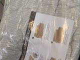 a picture of a bag of bedding that is wrapped in plastic