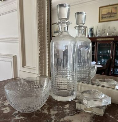 a glass vase and a bowl on a table
