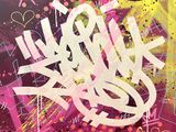 a close up of a painting of graffiti on a wall