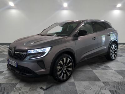 a grey suv parked in a room with a checkered floor