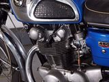 a blue motorcycle that is parked in a garage