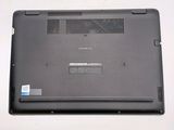 a black laptop with a blue sticker on it