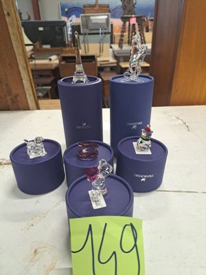 a table with a bunch of purple containers on it