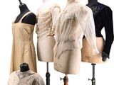 three mannequins are lined up in a row with dresses on them