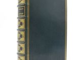 a black book with gold trim and gold trim on the cover