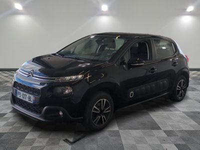 the black citrole is parked on a checkered tile floor
