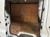 a white van that has a door open in a room