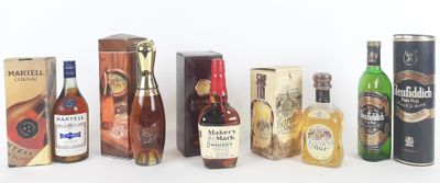 several bottles of alcohol are lined up in a row on a white surface