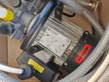 a box that has a bunch of hoses and a pump in it