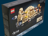 a box with a lego set in it on a blue background