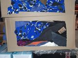a cardboard box with a bra top on top of it