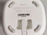 an image of a close up of a white device plugged into a wall