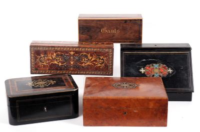 three wooden boxes with decorative designs on them sitting next to each other
