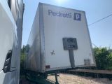 a semi truck with a semi trailer attached to the back of it