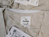 two tags attached to the back of a pair of pants