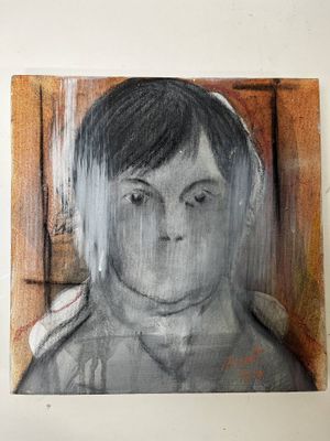 un tableau représentant un jeune garçon au regard triste