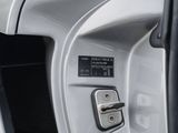 a close up of a car ' s door handle with a button