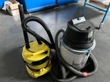 a yellow vacuum cleaner sitting on the floor next to a blue chair