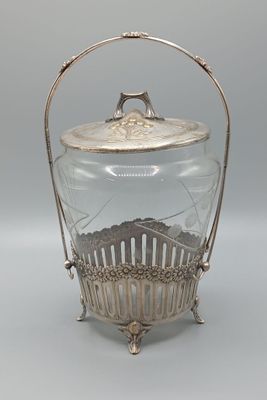 un bocal en verre ancien plaqué argent, muni d'une poignée et d'un couvercle