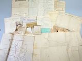some old papers are piled on top of each other on a table