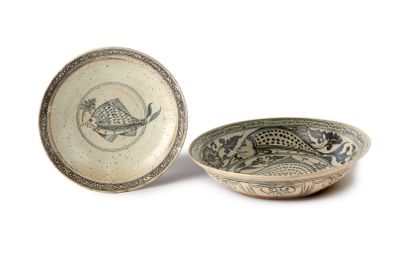 a bowl and a bowl with a fish design on it
