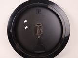 a black plate with a spoon and fork on it