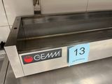 a metal counter with a sign on it that says gmm 13