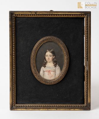 an old picture of a young girl in a white dress in a gold frame