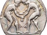 an image of a silver coin with two men wrestling on it