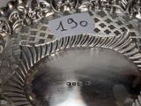 a silver plate that has a price tag on it