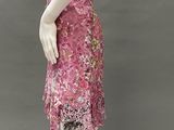 an image of a mannequin wearing a pink dress with flowers on it