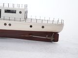 a model of a boat sitting on a snow covered surface