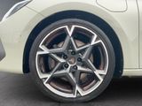 a close up of a car ' s wheel on the street