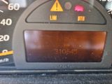 a close up of a car ' s dashboard with a speedometer