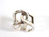 silver ring with inter links on a white background