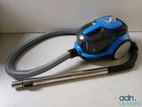a blue and black vacuum on a white table
