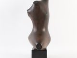 sculpture of a woman ' s torso on a black base against a white background