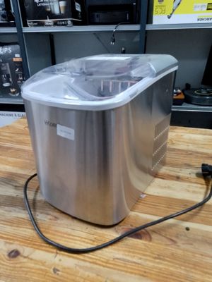 an image of a small ice cream maker on a table