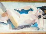 un tableau représentant une femme allongée sur un lit