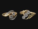 deux bagues en or et en argent serties de diamants sur fond noir
