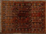 an old rug with a pattern on it on a stone floor