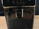 the coffee machine is sitting on the table ready to be used