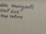 a picture of a sign on a wall that says pablo morgani about 2011