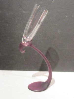 a wine glass that is sitting on top of a table