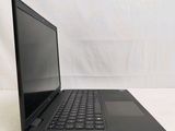 an open laptop computer sitting on top of a white table