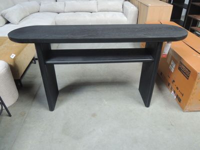 a black table with a shelf on it in a room