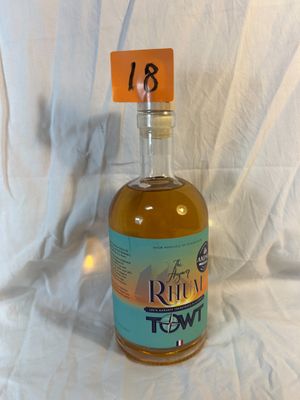 a bottle of rum in front of a white background