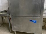 a stainless steel refrigerator in a kitchen with a lot of counter space
