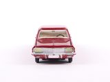 a red toy car that is sitting on a white surface