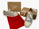pair of shoes with silver glitters and a red bag